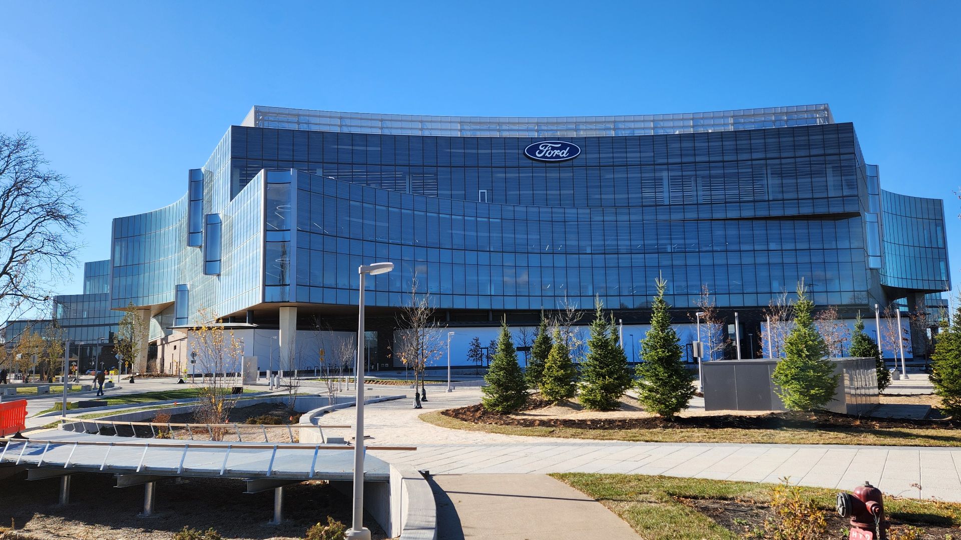 File:Ford World Headquarters from sidewalk, against sun.jpg