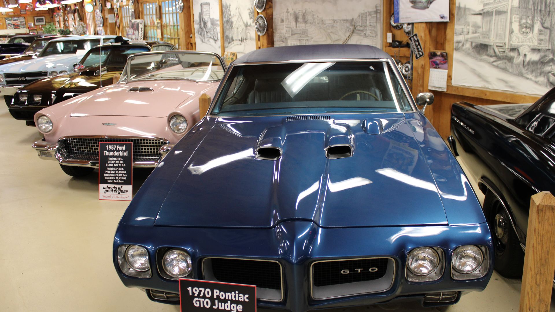 File:Blue 1970 Pontiac GTO and pink 1957 Ford Thunderbird at the Wheels of Yesteryear Vintage Auto Museum May 2022.jpg