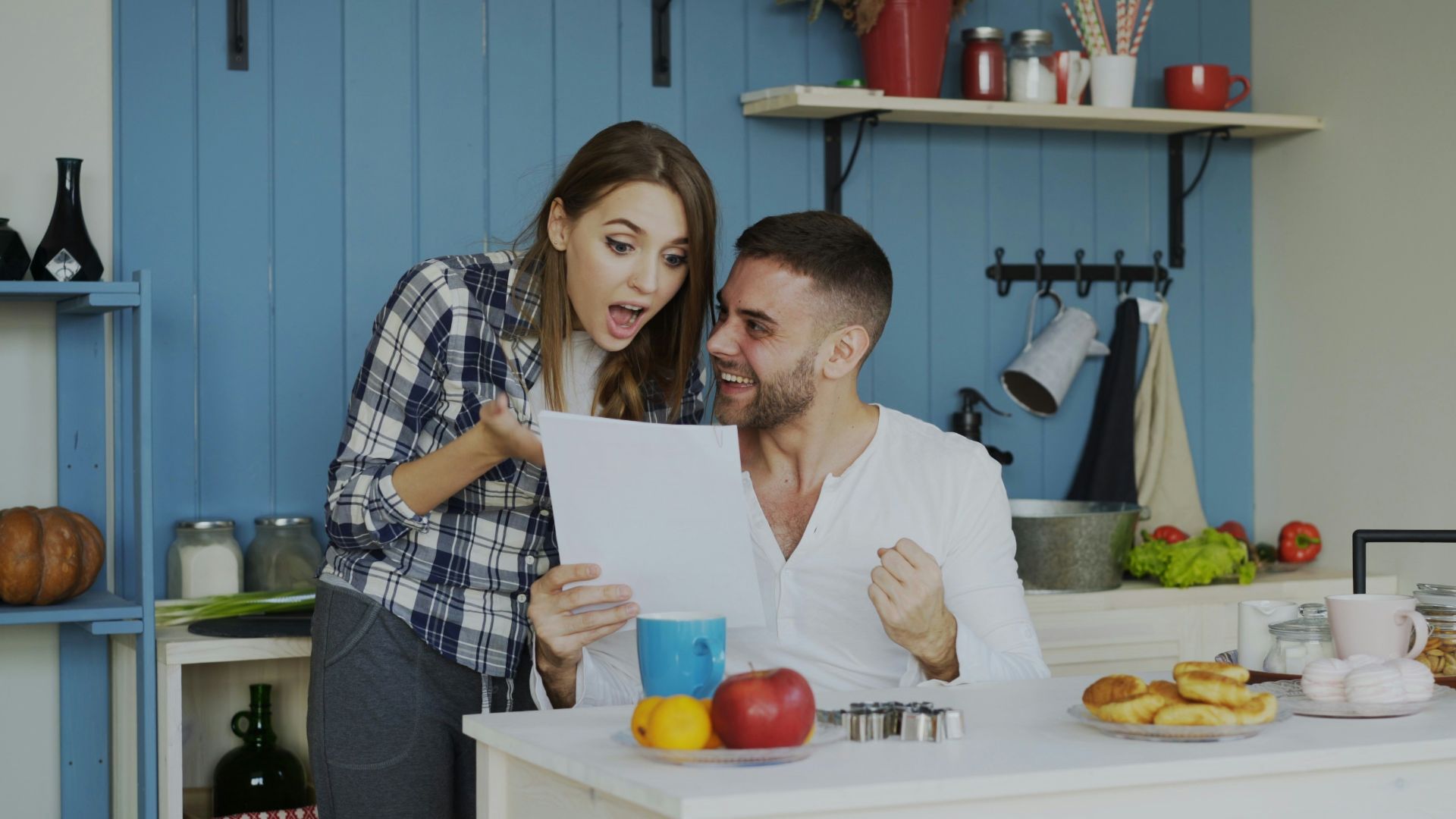 Couple reacting with excitement to a document