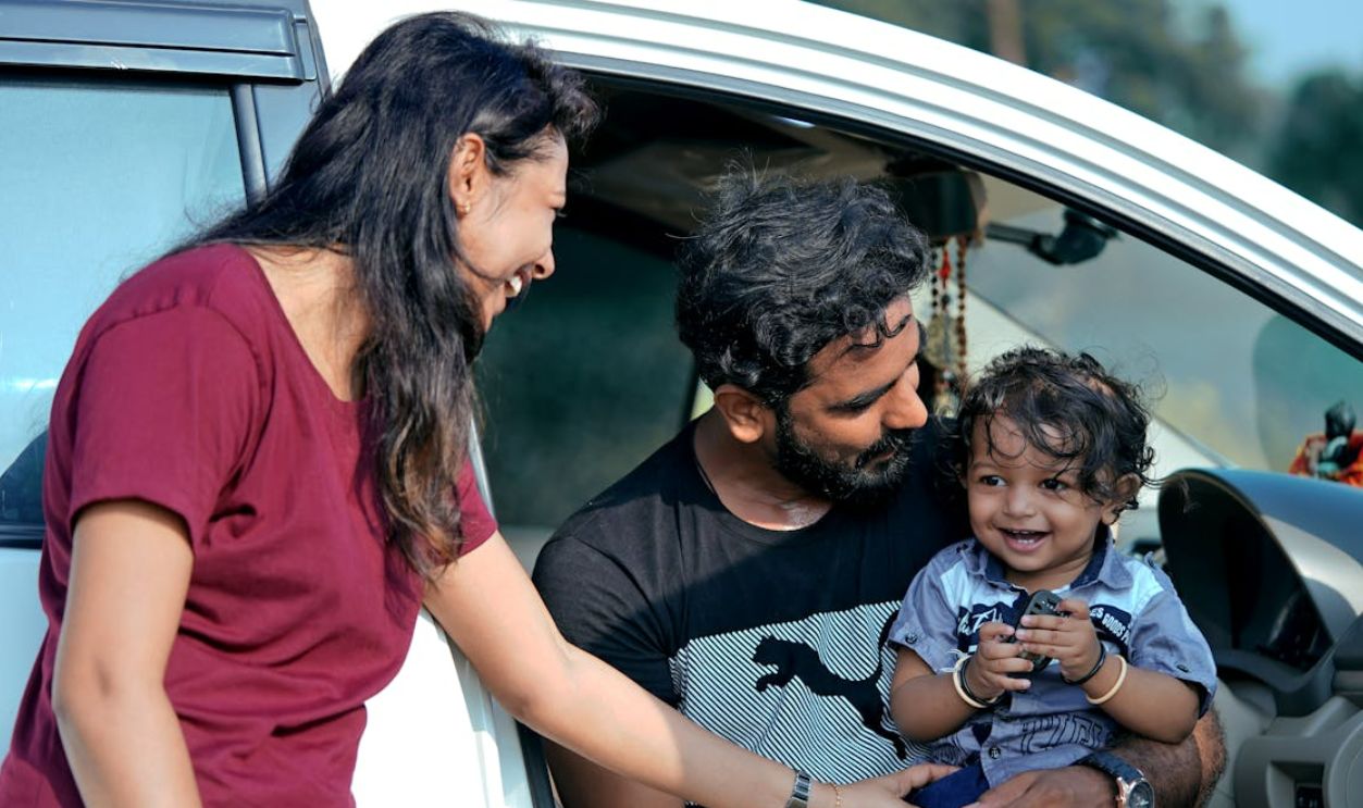 Parents with daughter in car