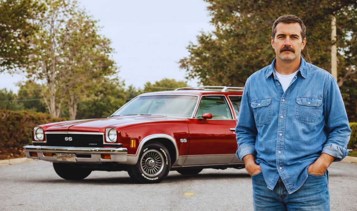 Man with red Chevelle SS station wagon