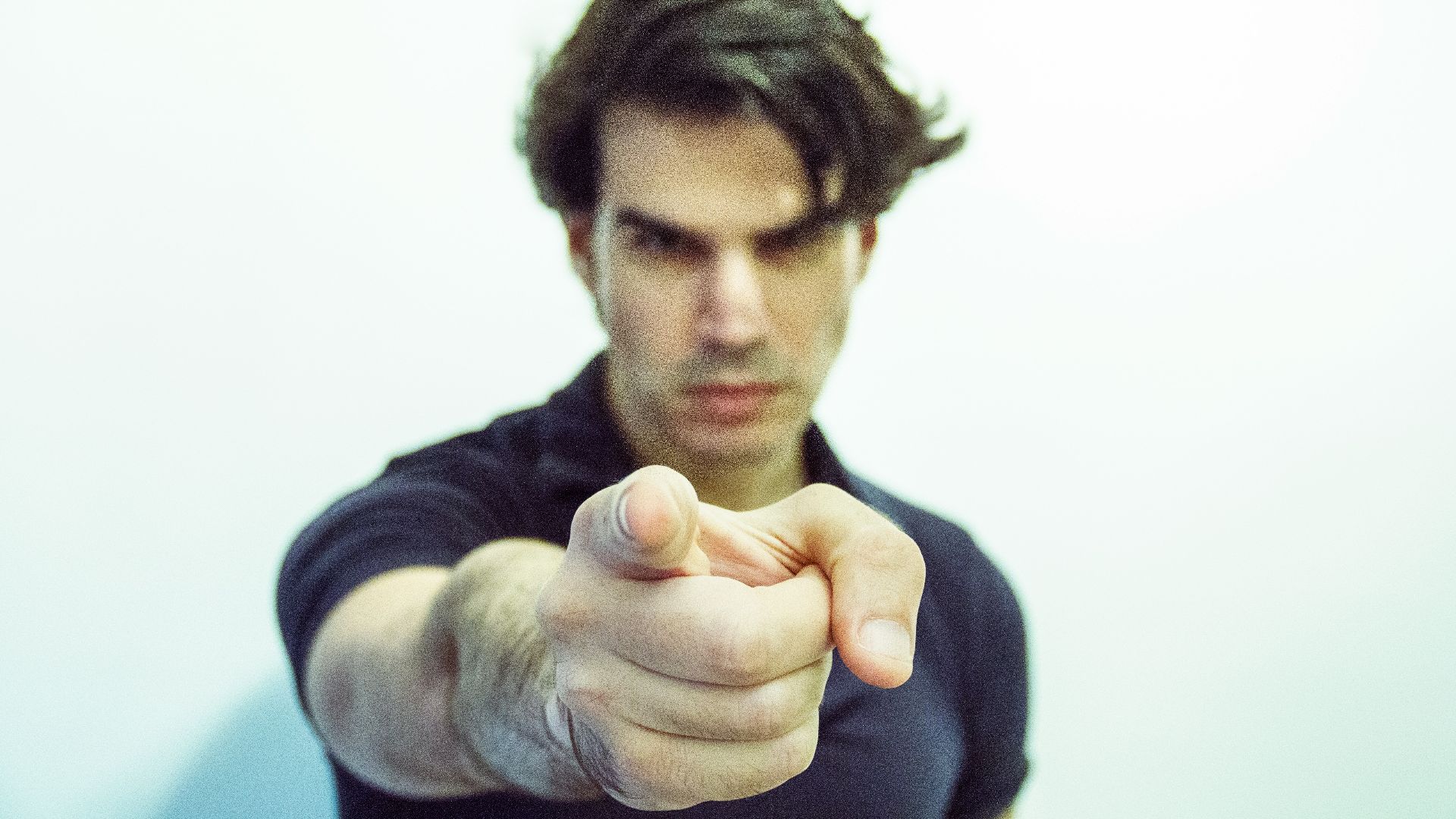 man pointing at camera