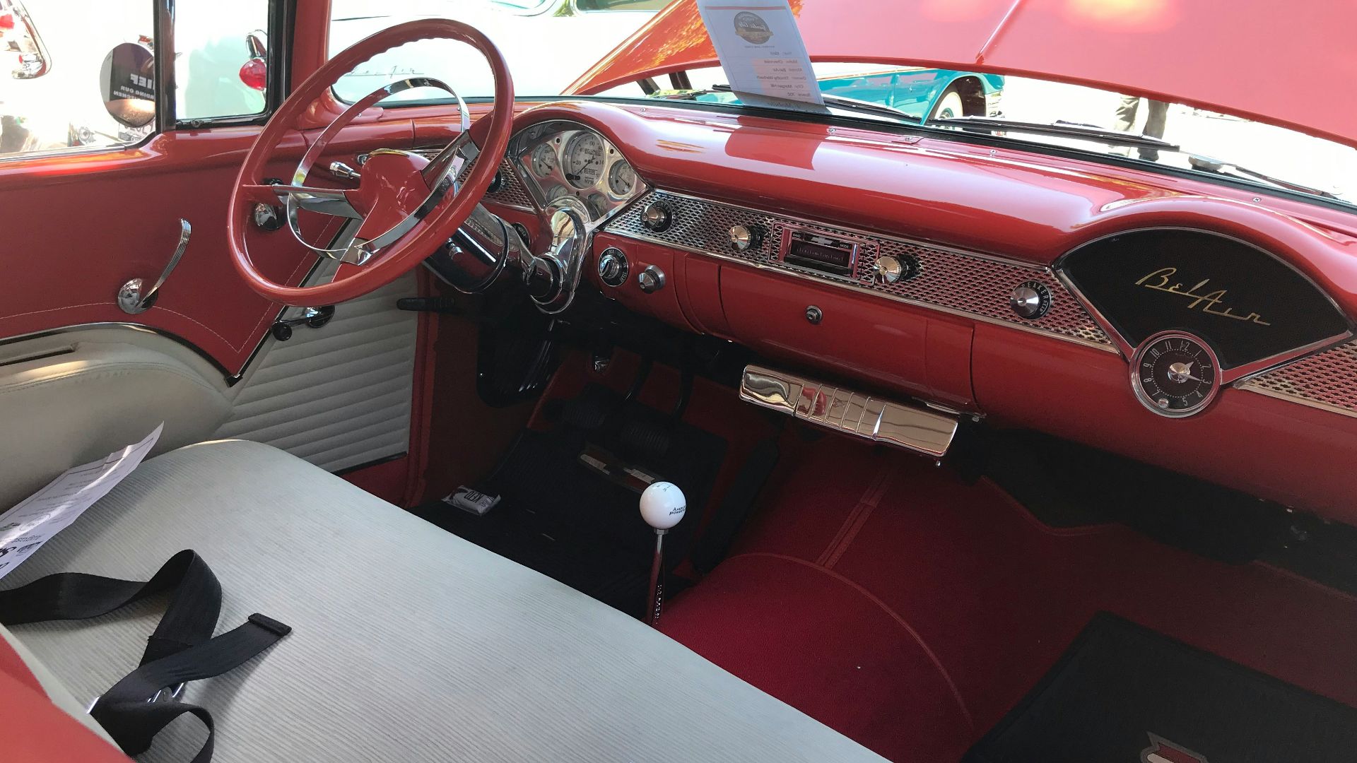 the interior of a car with a steering wheel and dashboard