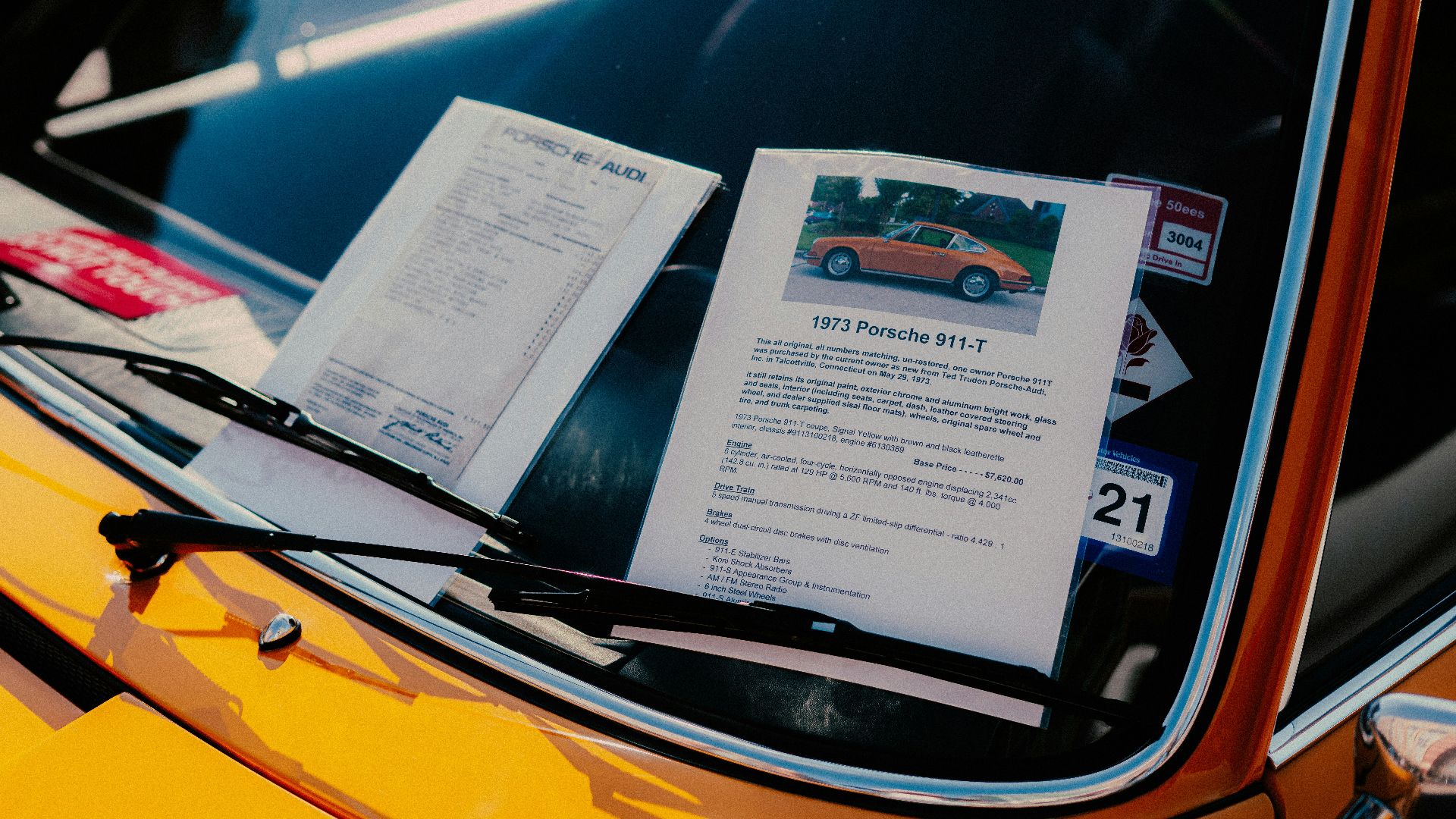 white printer paper on yellow car