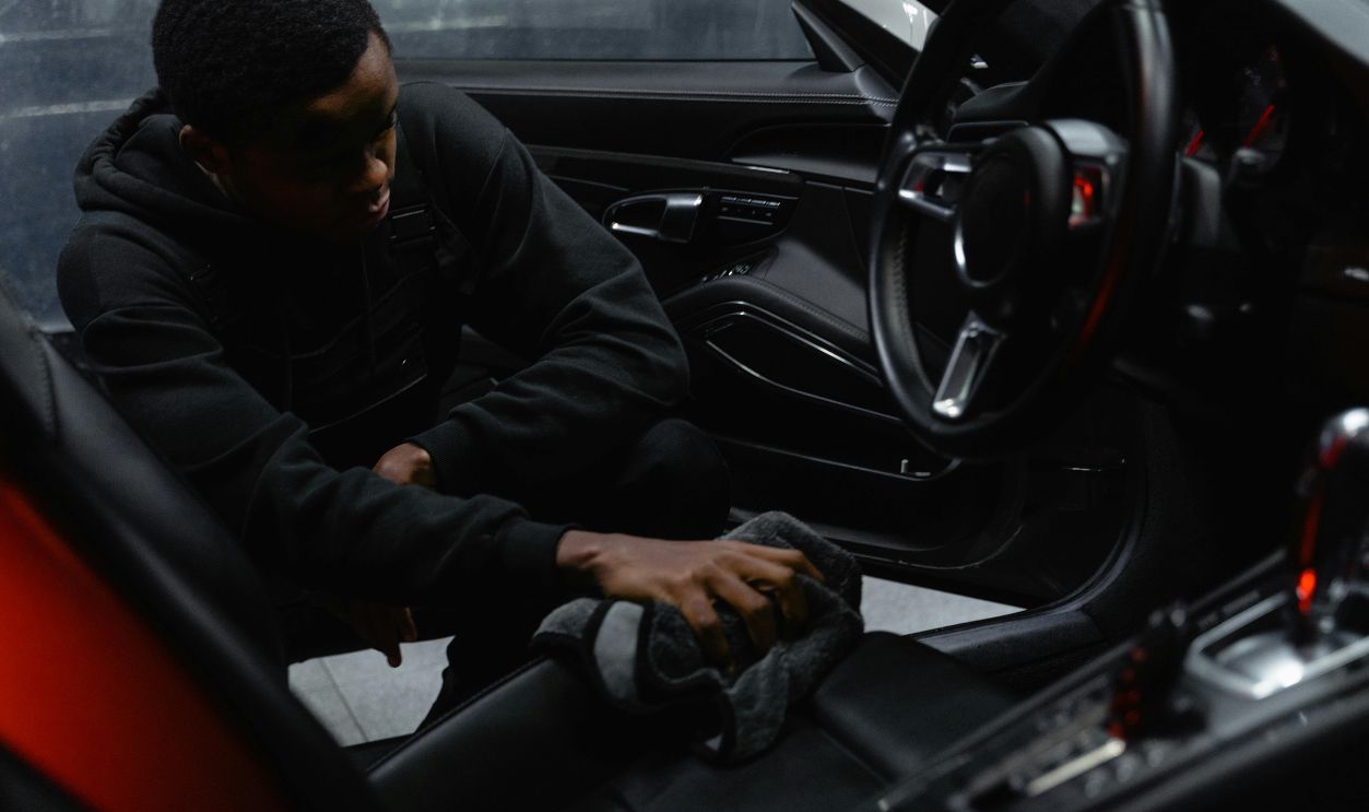 Man in black jacket cleaning