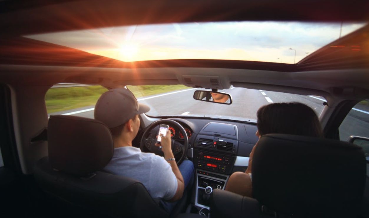 Man Using Smartphone While Driving