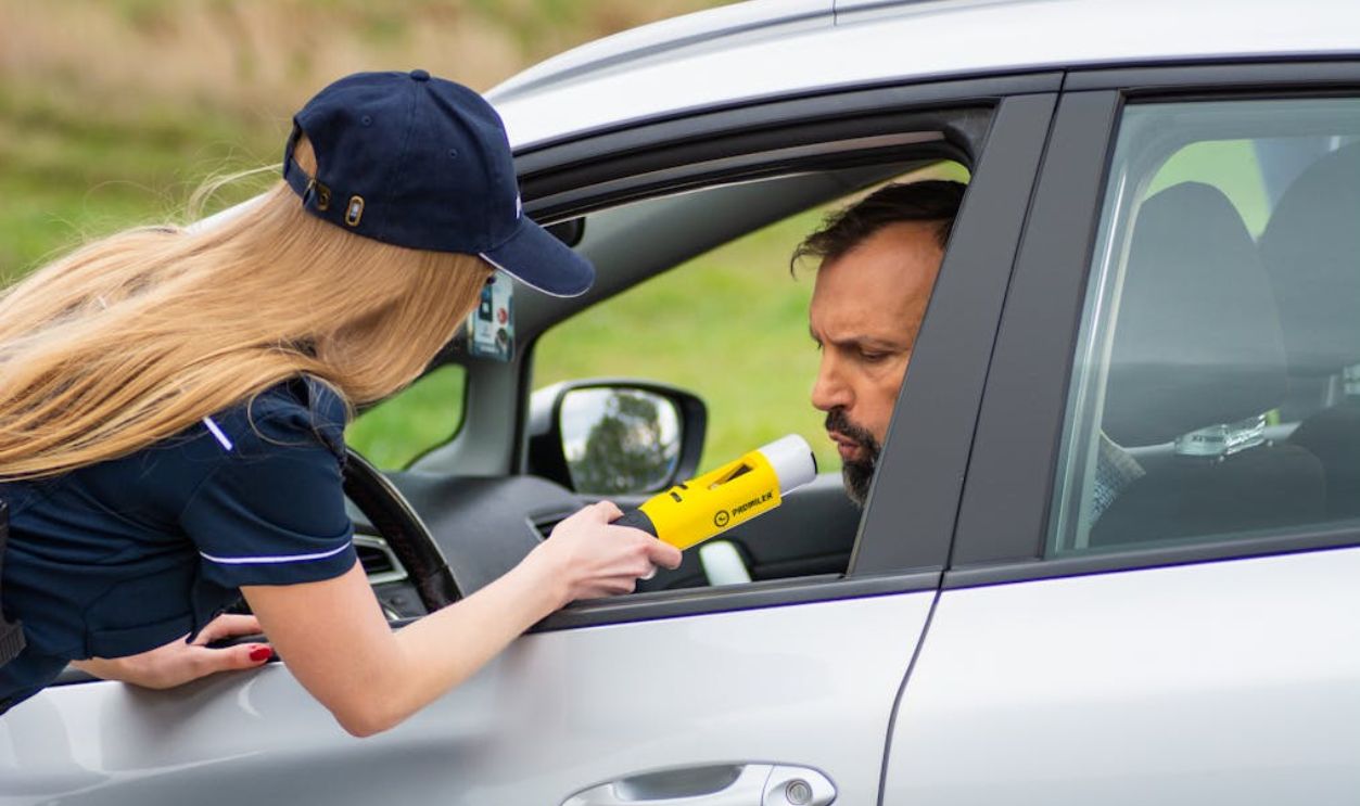 Police Officer Conducting DUI Check on Driver