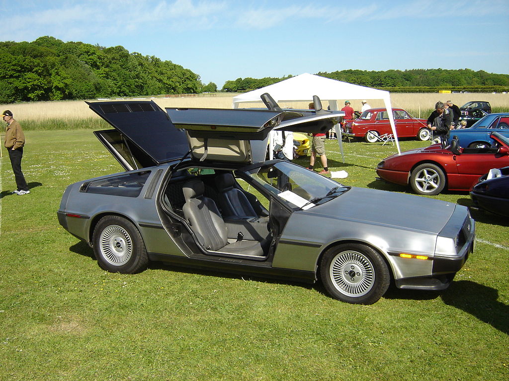 A close-up photo of a DeLorean DMC-12 car on display at an exhibition