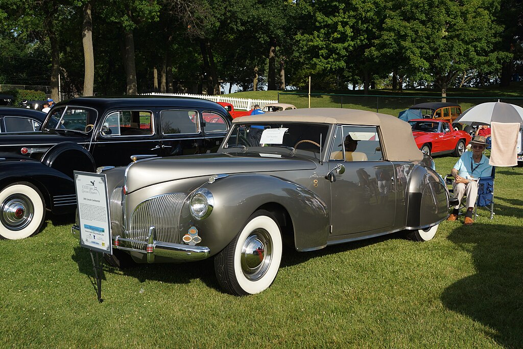 A close-up photo of a 1941 Lincoln Continental Cabriolet car on display at an exhibition