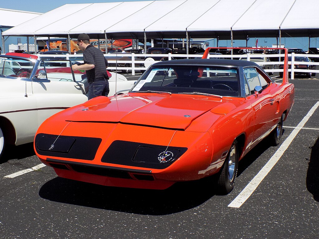 A close-up photo of a 1970 Plymouth Road Runner Superbird car on display at an exhibition