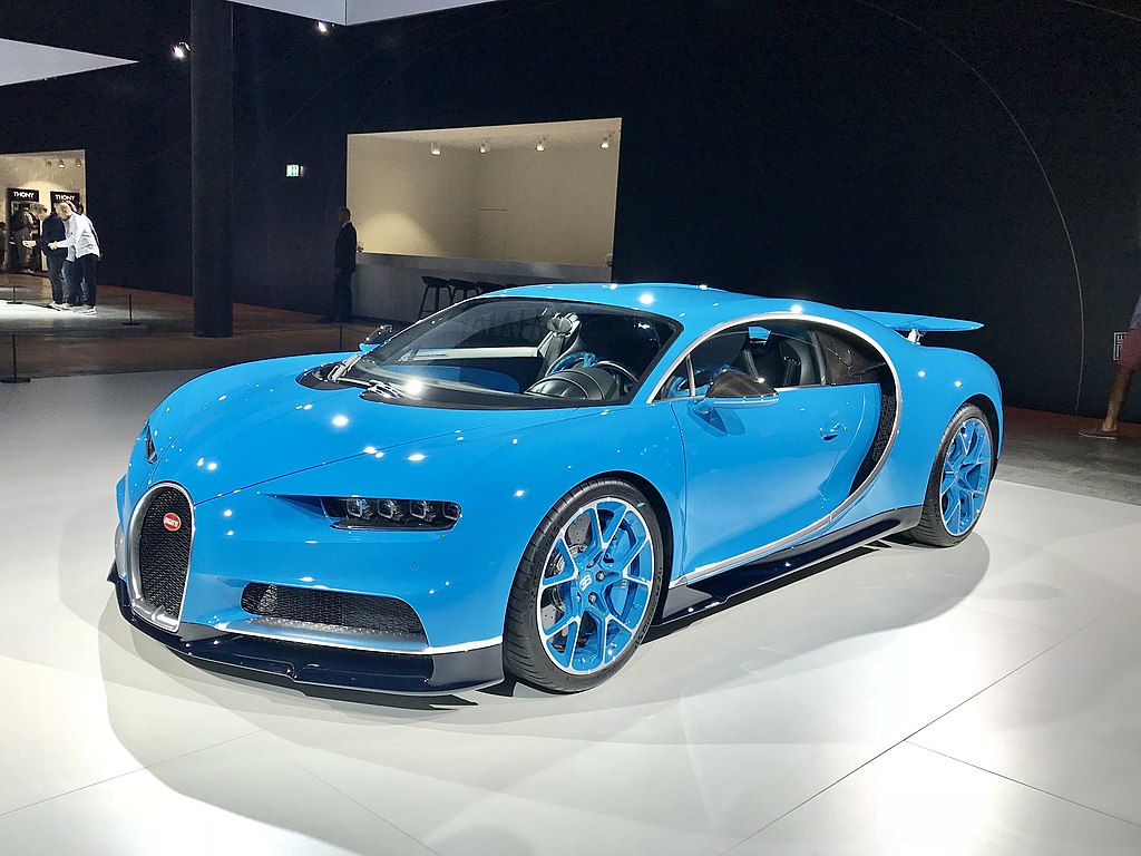 A close-up photo of a 2018 Blue Bugatti Chiron car on display at an exhibition