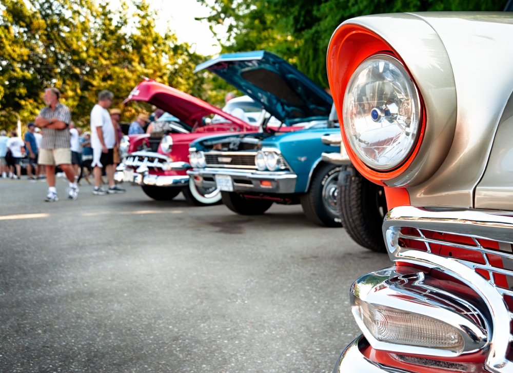 Vintage cars on display at classic automotive exhibition.