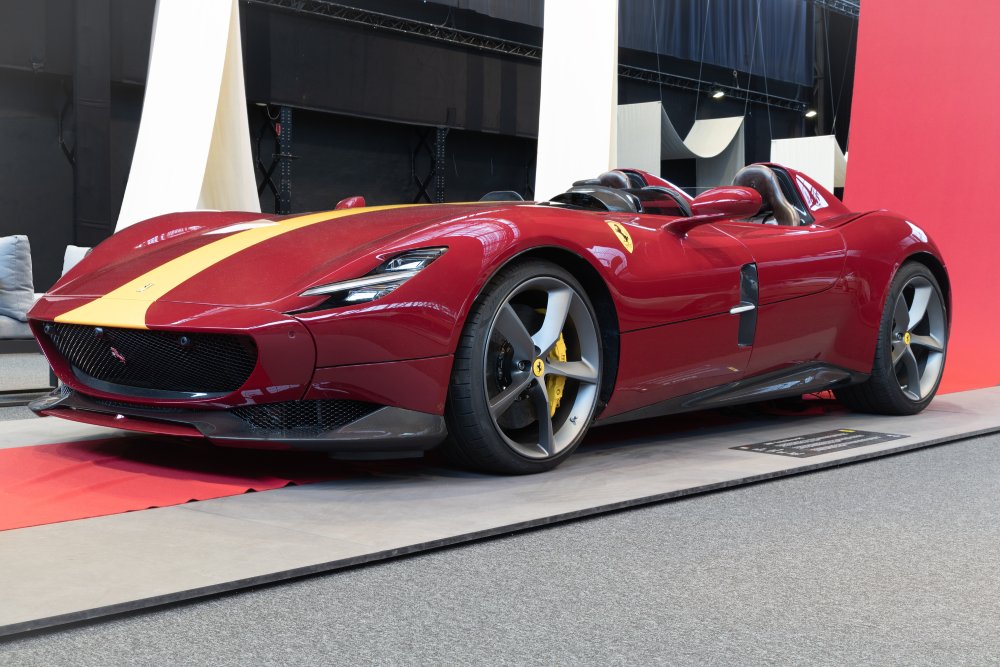 A close-up photo of a Ferrari Monza SP2 car on display at an exhibition