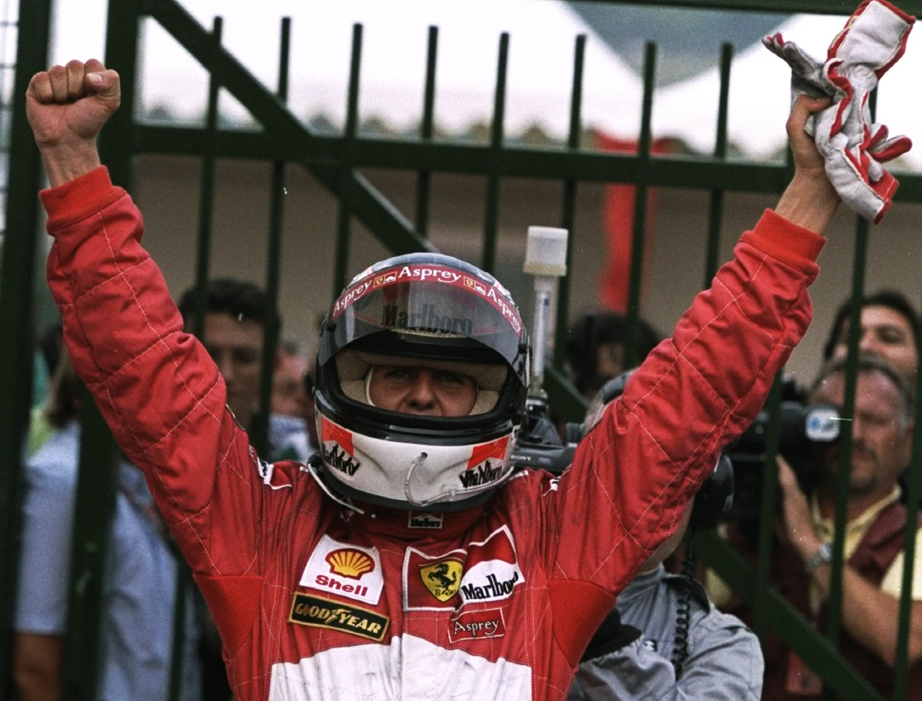 1998: Ferrari driver Michael Schumacher of Germany acknowledges the crowd after his victory in the Hungarian Grand Prix