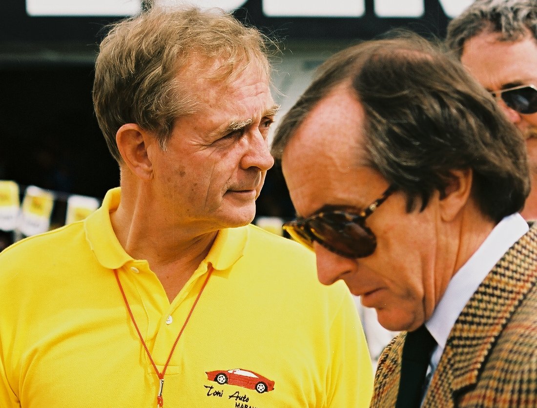 Phil Hill (left) and Jackie Stewart (right) at the United States Grand Prix