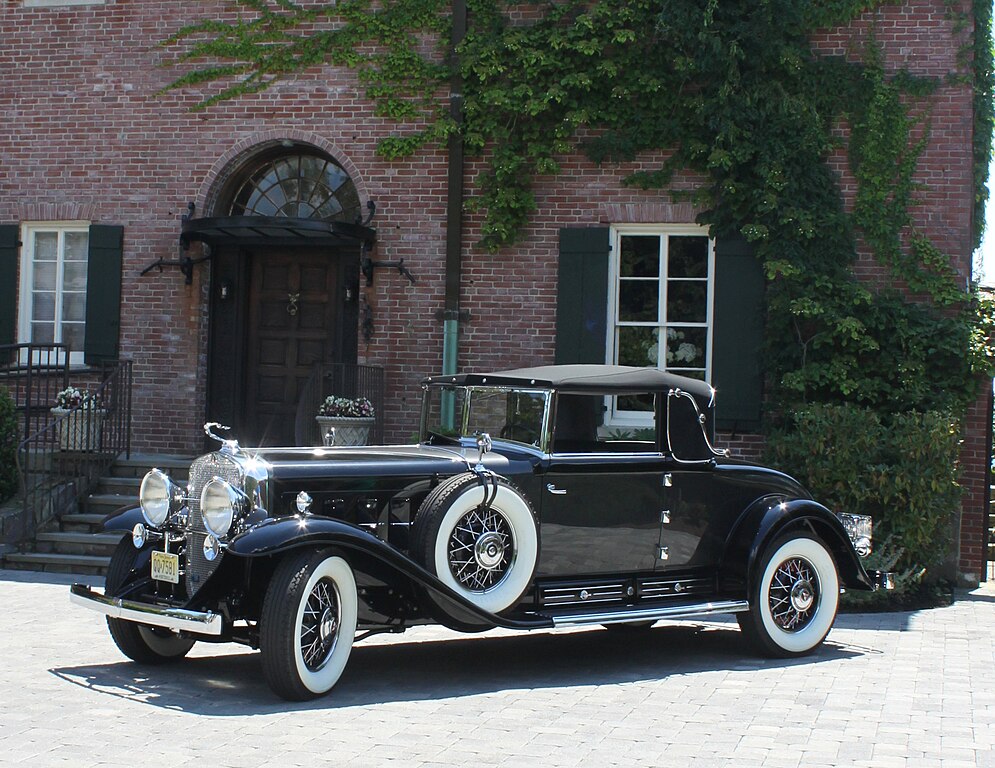 A close-up photo of a Cadillac Fleetwood V16 car parked in a parking lot