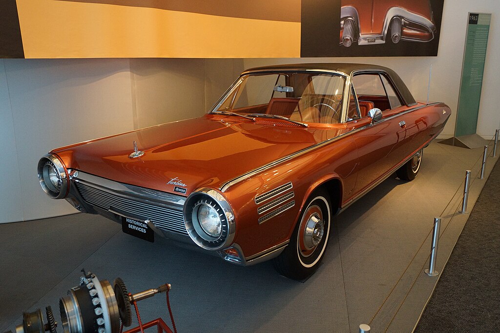 A close-up photo of a 1963 Chrysler Turbine car on display at an exhibition