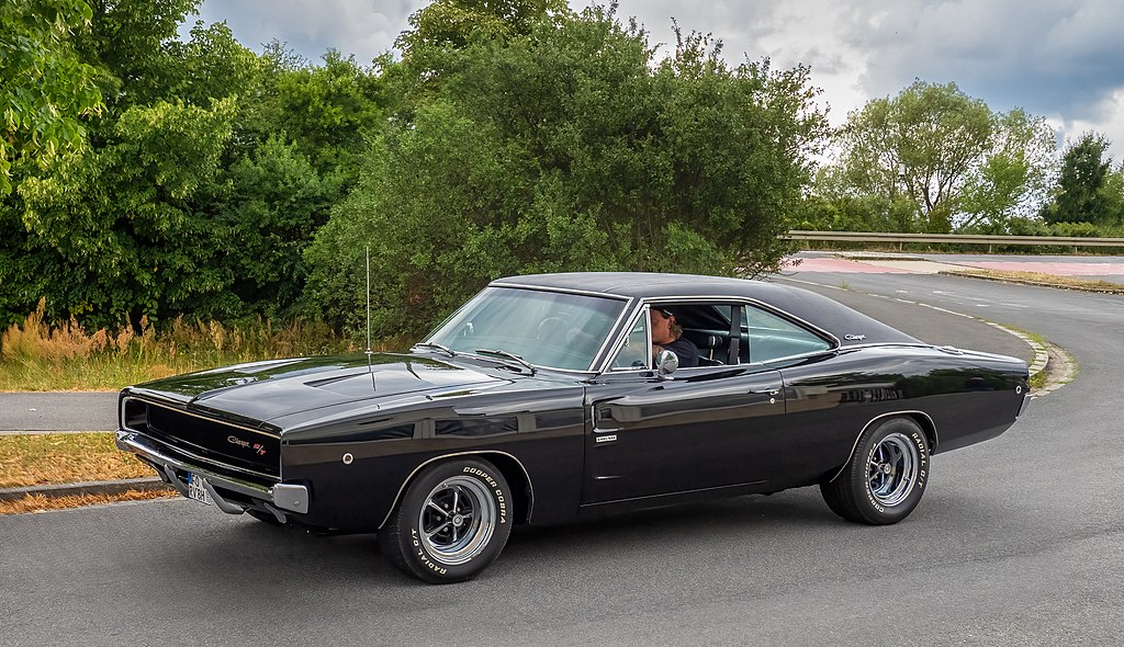 A close-up photo of a 1970 Dodge Charger R-T car in motion
