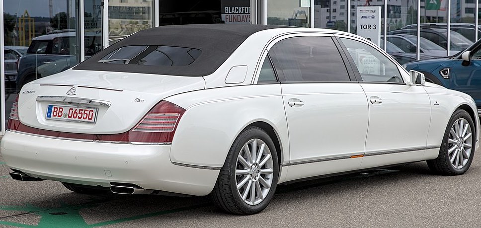 A close-up photo of a Maybach 62 S Landaulet car parked on a city street