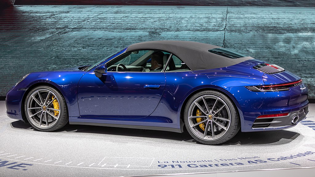 Porsche 991 Carrera Cabriolet car on display at an exhibition