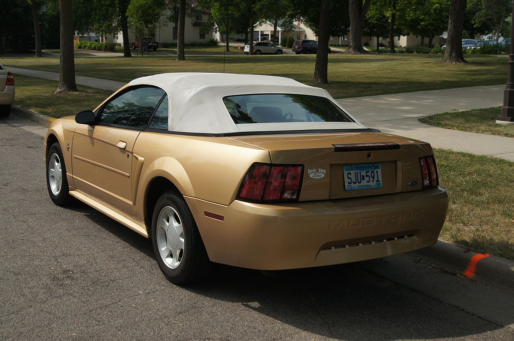 Ford Mustang Convertible car parked on a city street