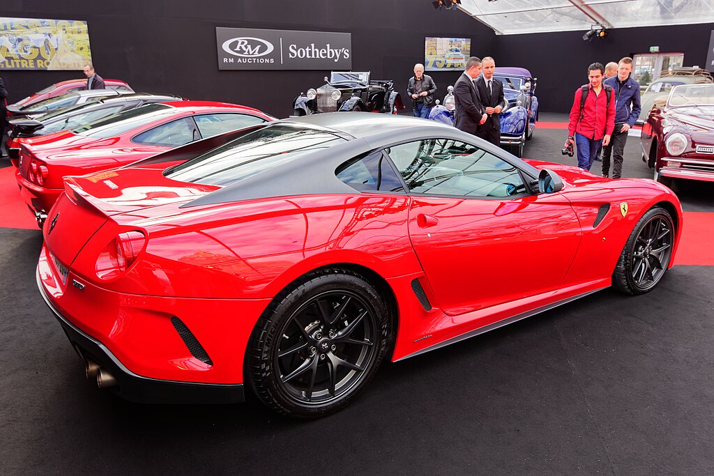 A close-up photo of a 2011 Ferrari 599 GTO car on display at an exhibition