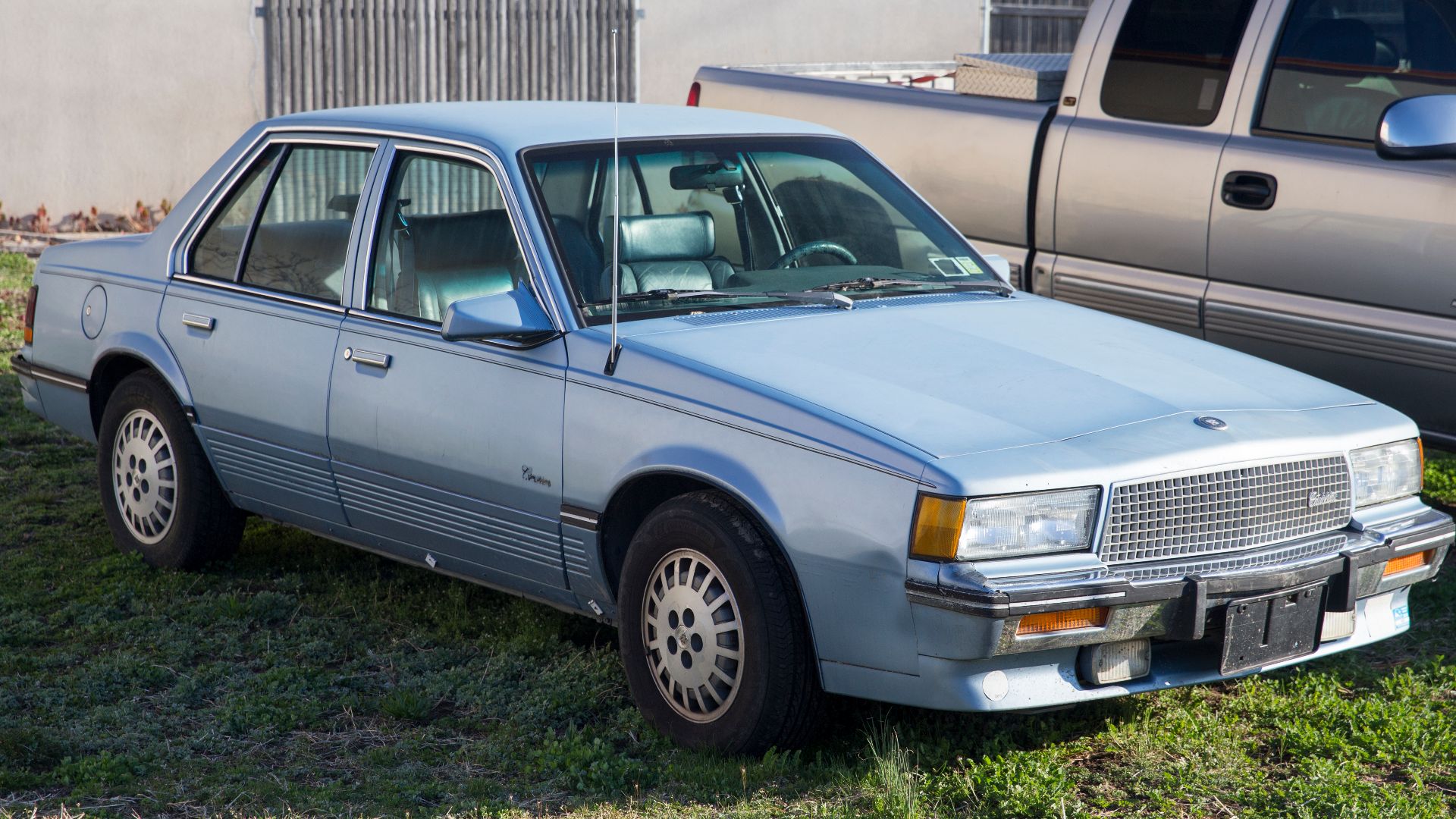 File:1988 Cadillac Cimarron in Bluish Silver, front right.jpg