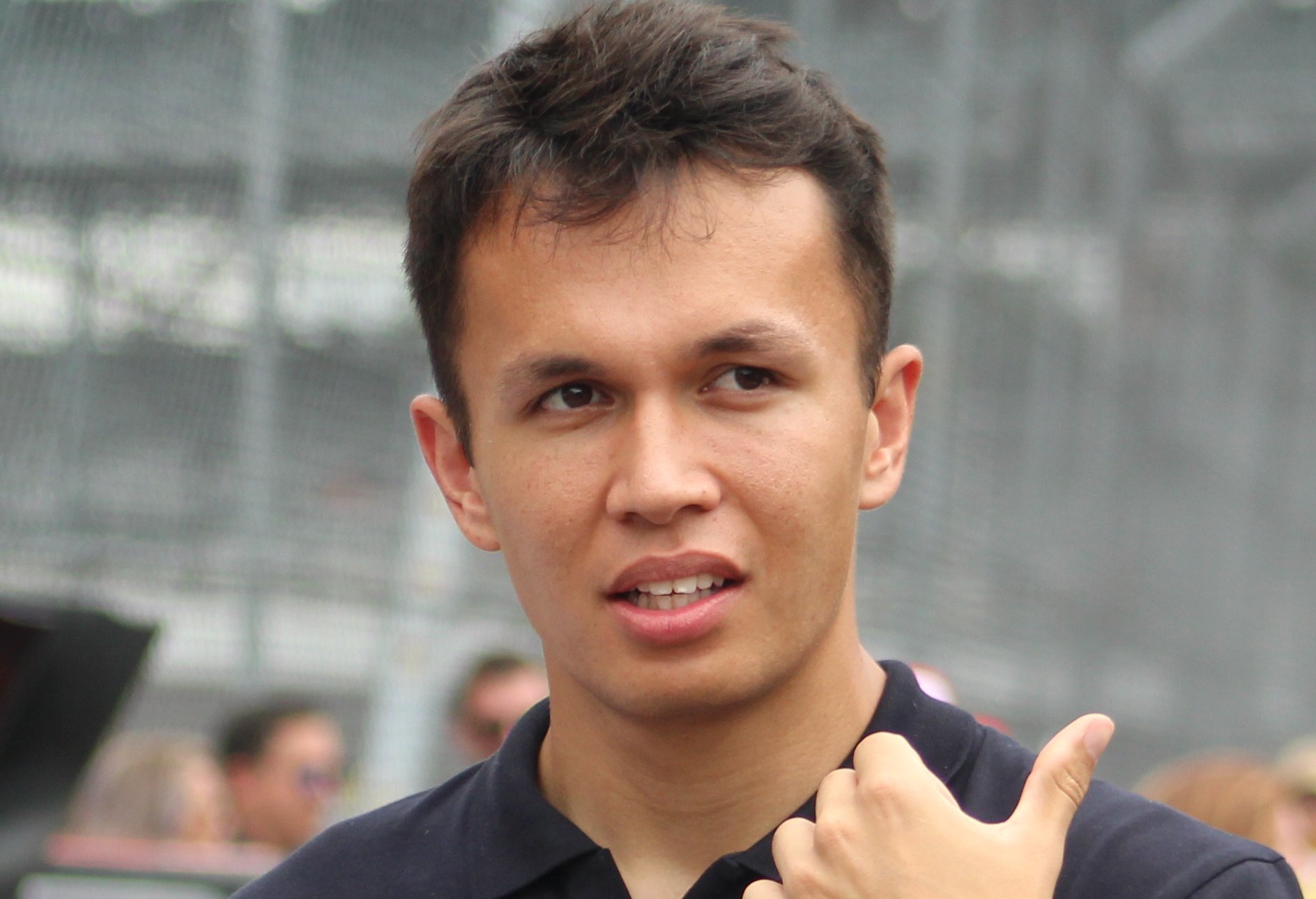 Thai and British racing driver Alex Albon in a black shirt