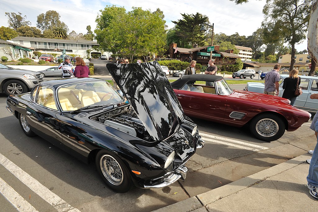 A 1965 Lamborghini 350 GT coupe receives closer inspection.