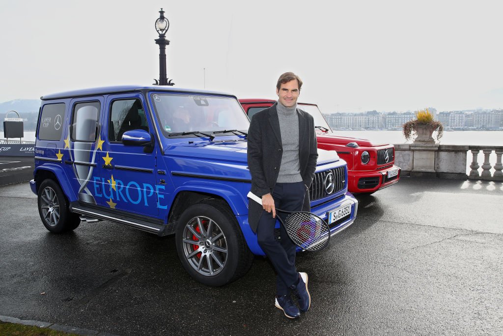 Roger Federer of Switzerland poses for a photo with the Mercedes Team Europe car