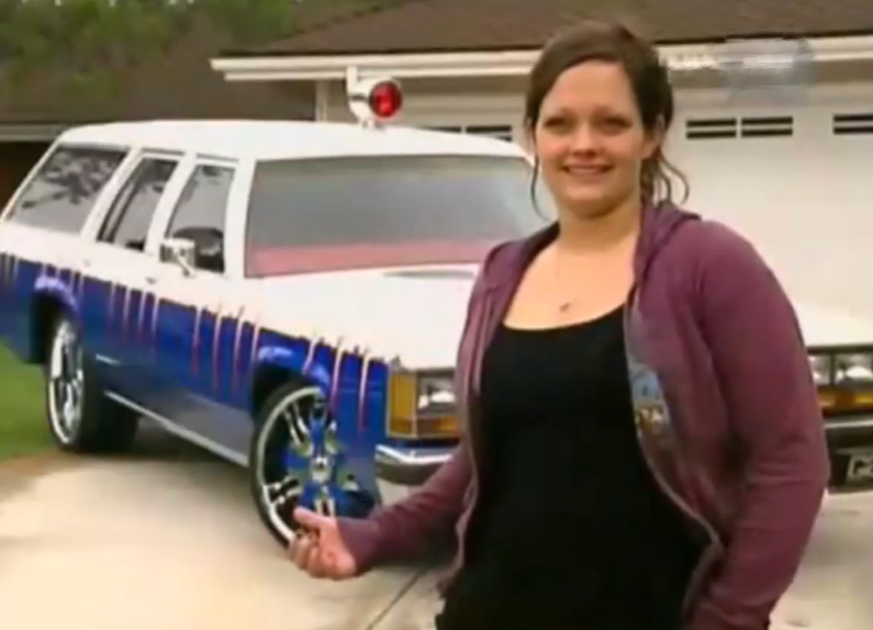 Woman in front of a car