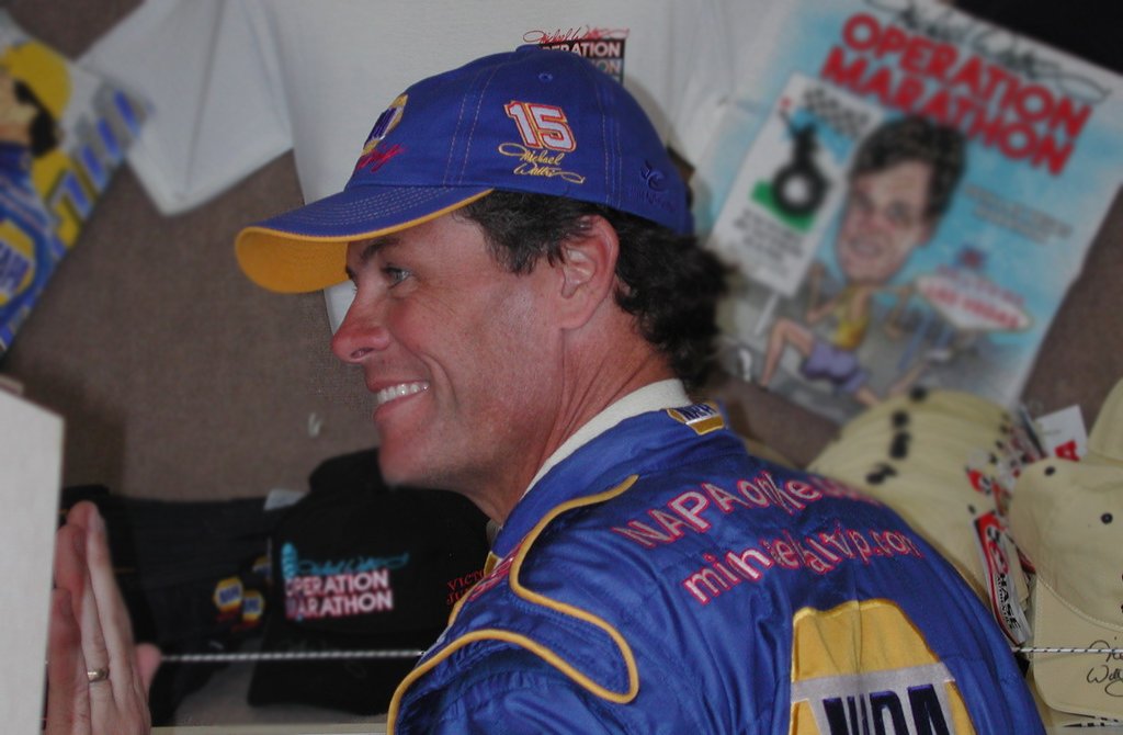 Michael Waltrip signing autographs from his trailer