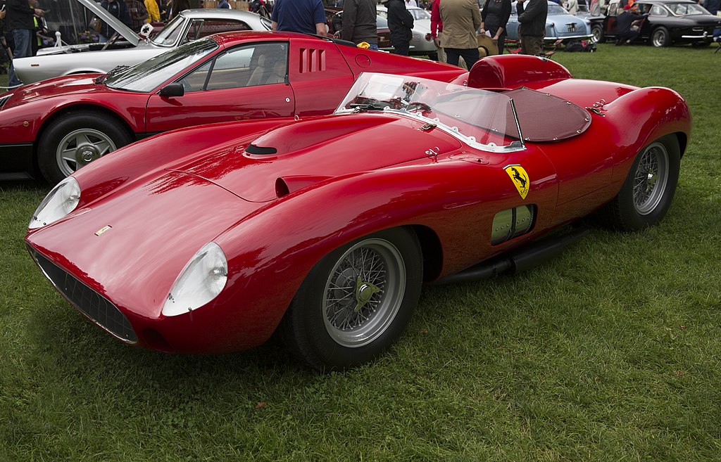 A close-up photo of a Ferrari 335 S car on display at an exhibition
