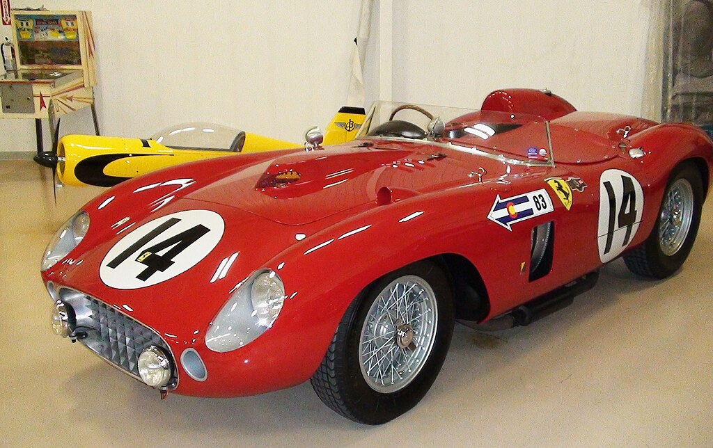 A close-up photo of a Ferrari 290 MM car on display at an exhibition