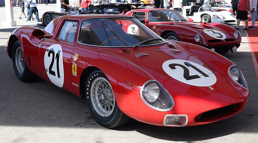 A close-up photo of a Ferrari 250 LM car on display at an exhibition
