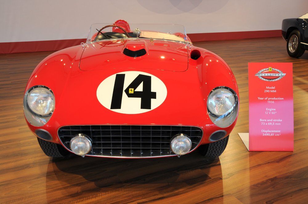 A close-up photo of a Ferrari 290 MM car on display at an exhibition