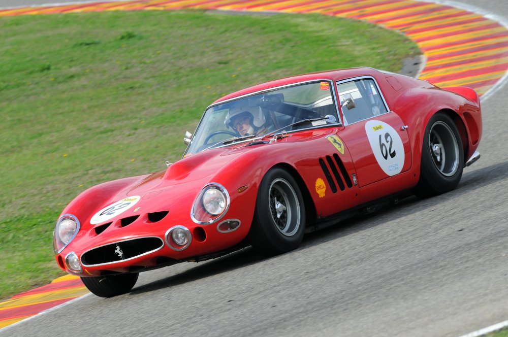A close-up photo of a Ferrari 250 GTO car on display at an exhibition