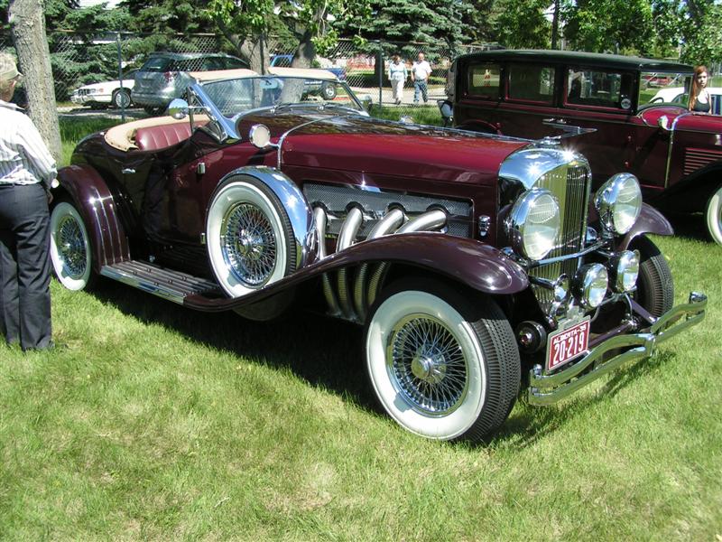 A close-up photo of a Duesenberg SSJ car on display at an exhibition