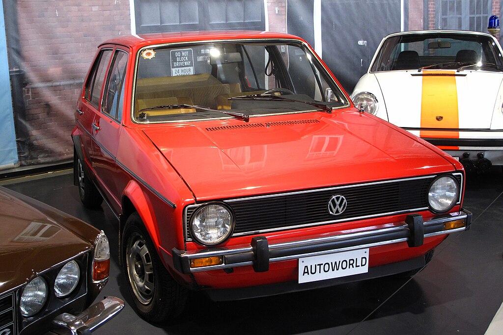 A close-up photo of a Volkswagen Golf car on display at an exhibition