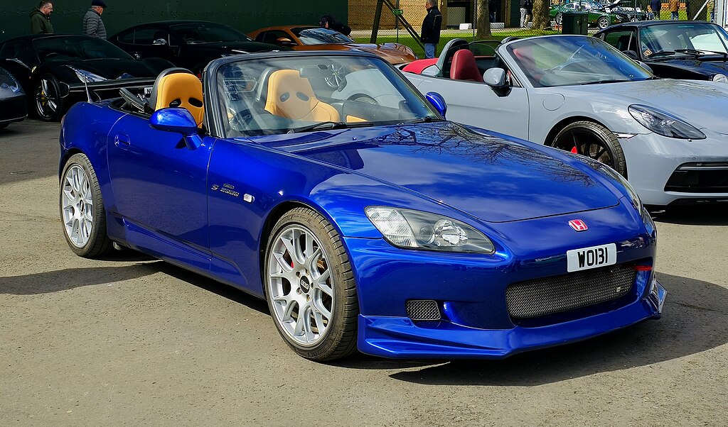 A close-up photo of a Honda S2000 car on display at an exhibition