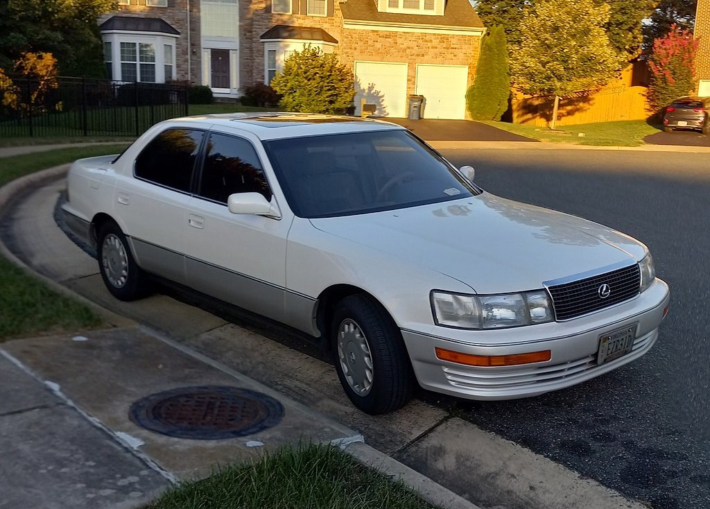A close-up photo of a Lexus LS 400 car parked on a city street