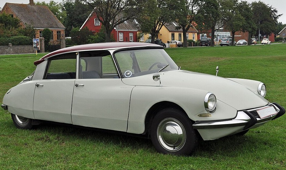 A close-up photo of a Citroën DS 19 car on display at an exhibition
