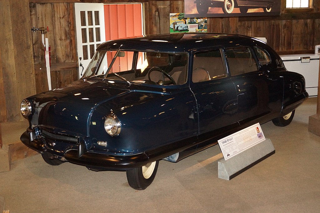 A close-up photo of a 1946 Stout Scarab car on display at an exhibition