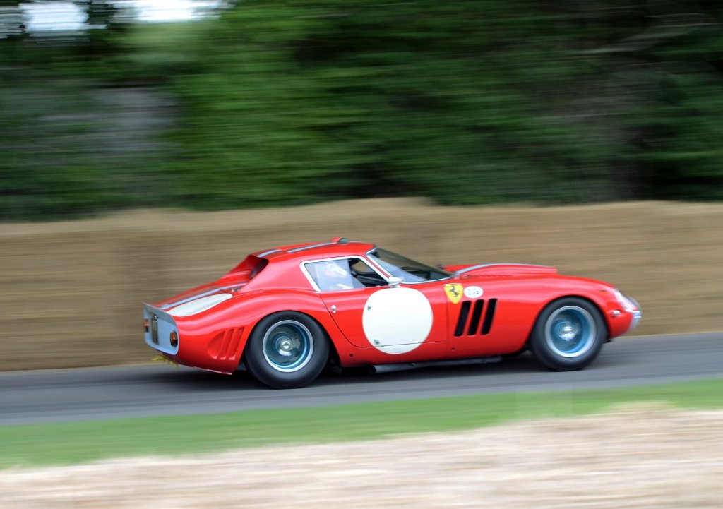 A close-up photo of a Ferrari 250 GTO car in motion