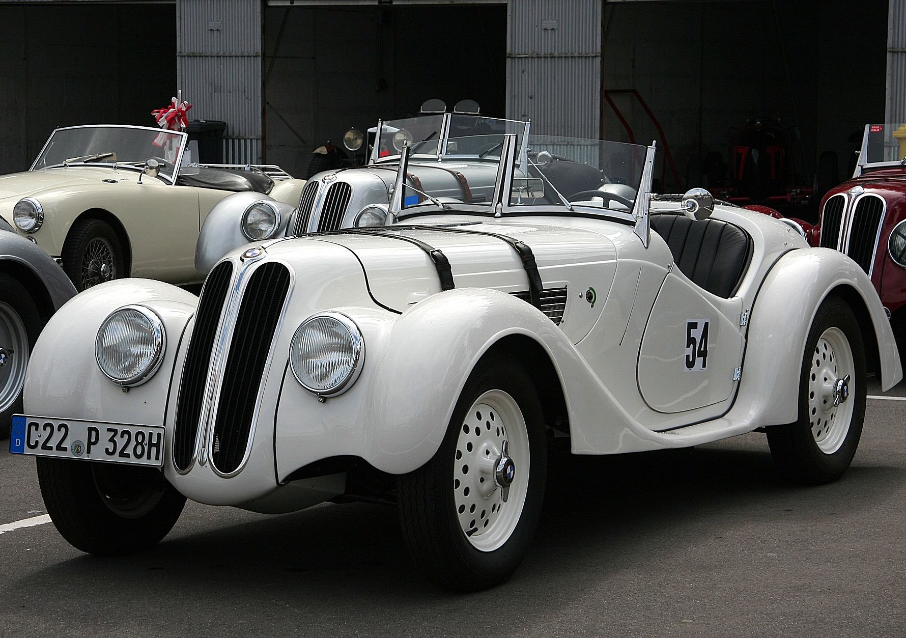 A close-up photo of a BMW 328 car on display at an exhibition