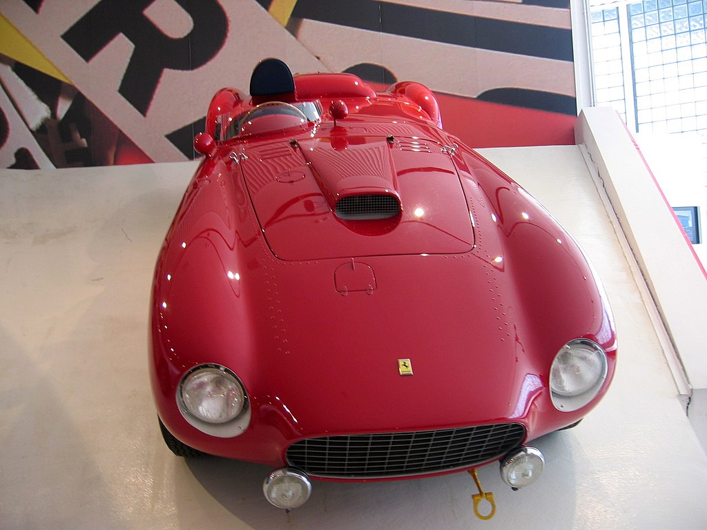 1954 Ferrari 375 Plus Spider Competizione car on display at an exhibition