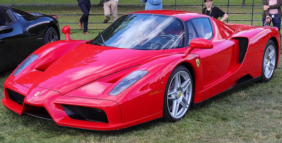 A close-up photo of a 2003 Ferrari Enzo car on display at an exhibition