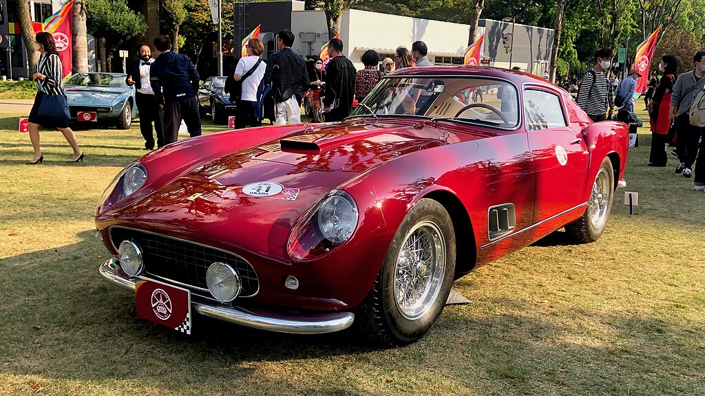 A close-up photo of a 1957 Ferrari 250 GT 14 car on display at an exhibition