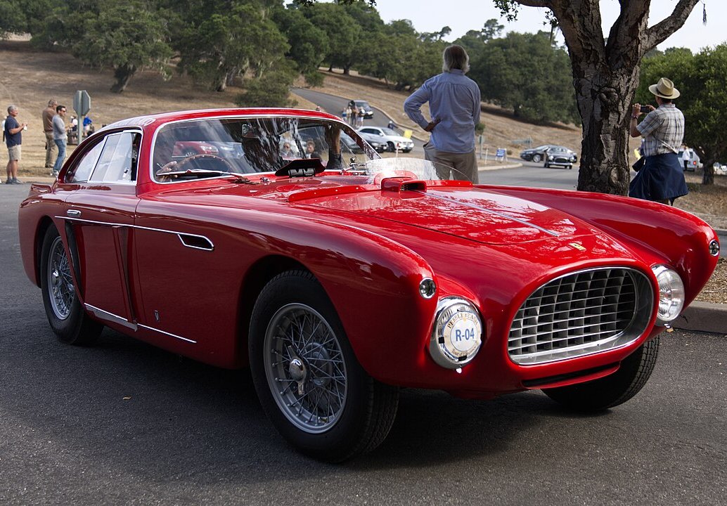 A close-up photo of a 1952 Ferrari 340 Mexico Coupe car in motion
