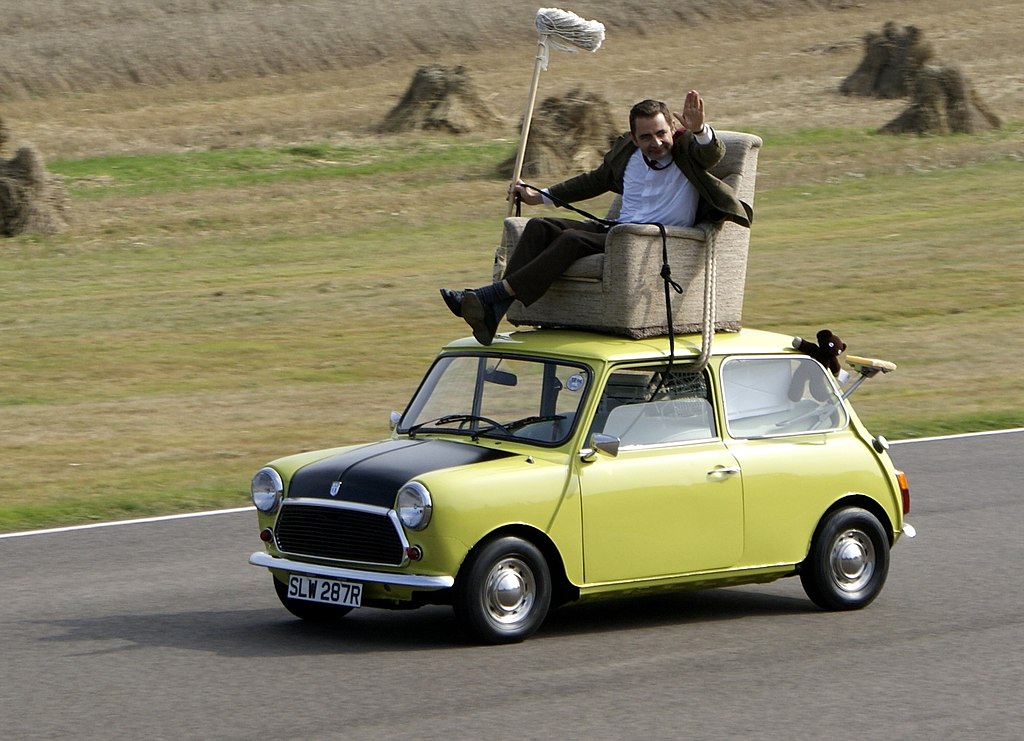 Rowan Atkinson on a Mini at Goodwood Circuit in 2009